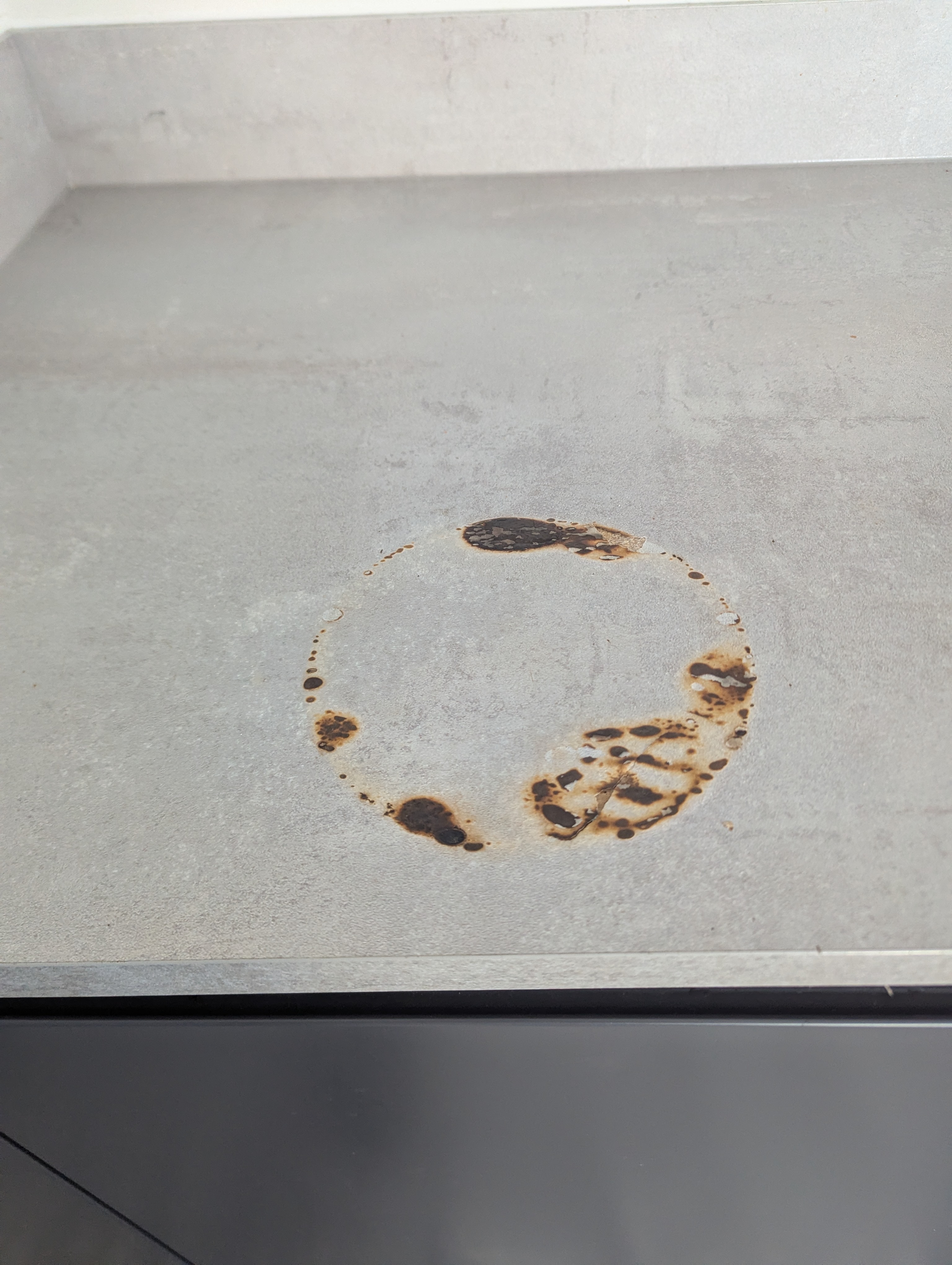 Burnt laminate worktop · before